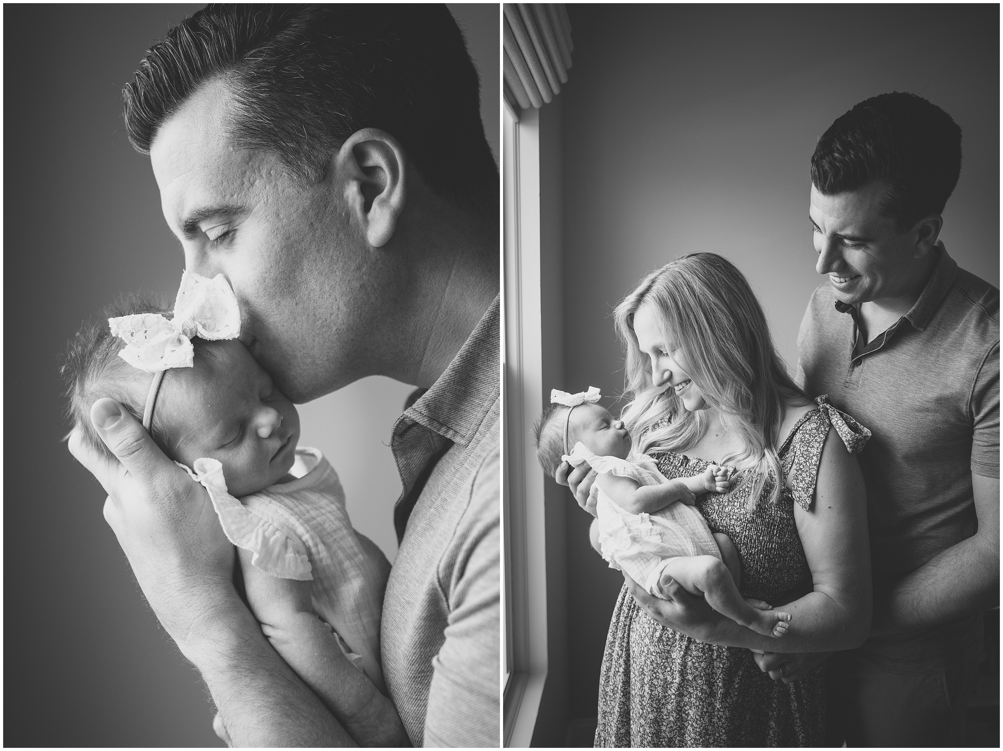 Black-and-white family portrait: father kisses sleeping newborn; mother smiles holding baby, with dad beside them, dramatic window light